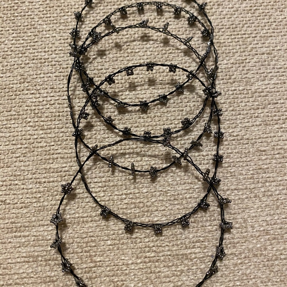 Black wire bracelets with silver stars